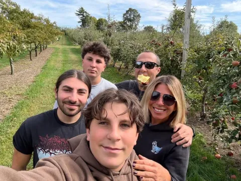 Helen and her family apple picking